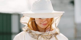 woman-beekeeper-looks-after-bees-wearing-coverall-woman-work-apiary